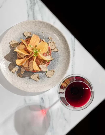 Beautifully plated dish in a restaurant setting captured by a hospitality photographer