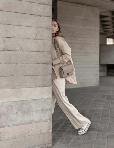 Fashion model wearing a luxury leather bag - photographed by London fashion photographer for brand campaign