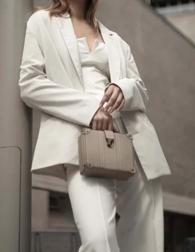 Fashion model wearing a luxury leather bag - photographed by London fashion photographer for brand campaign