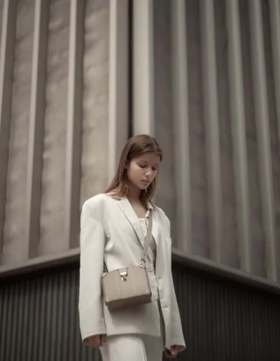 Fashion model wearing a luxury leather bag - photographed by London fashion photographer for brand campaign