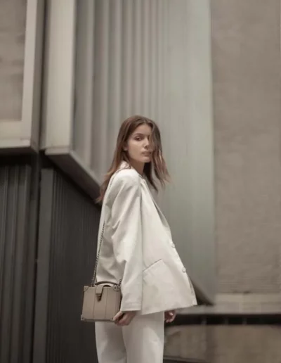 Fashion model wearing a luxury leather bag - photographed by London fashion photographer for brand campaign