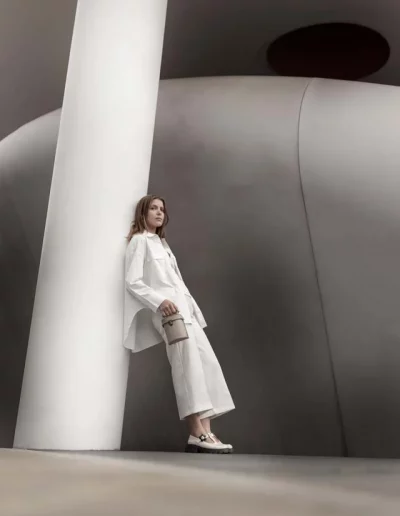 Fashion model wearing a luxury leather bag - photographed by London fashion photographer for brand campaign