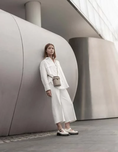 Fashion model wearing a luxury leather bag - photographed by London fashion photographer for brand campaign
