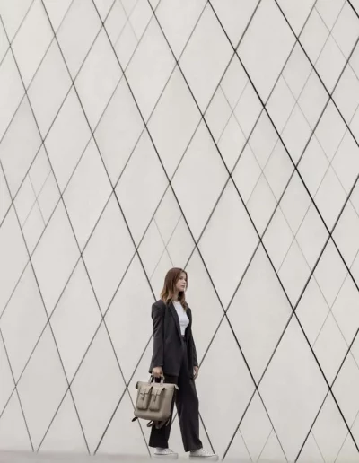 Fashion model wearing a luxury leather backpack