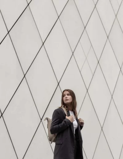 Fashion model wearing a luxury leather backpack