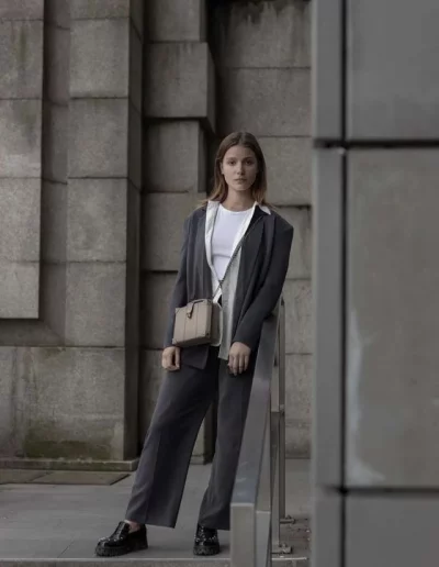 model wearing a luxury leather bag